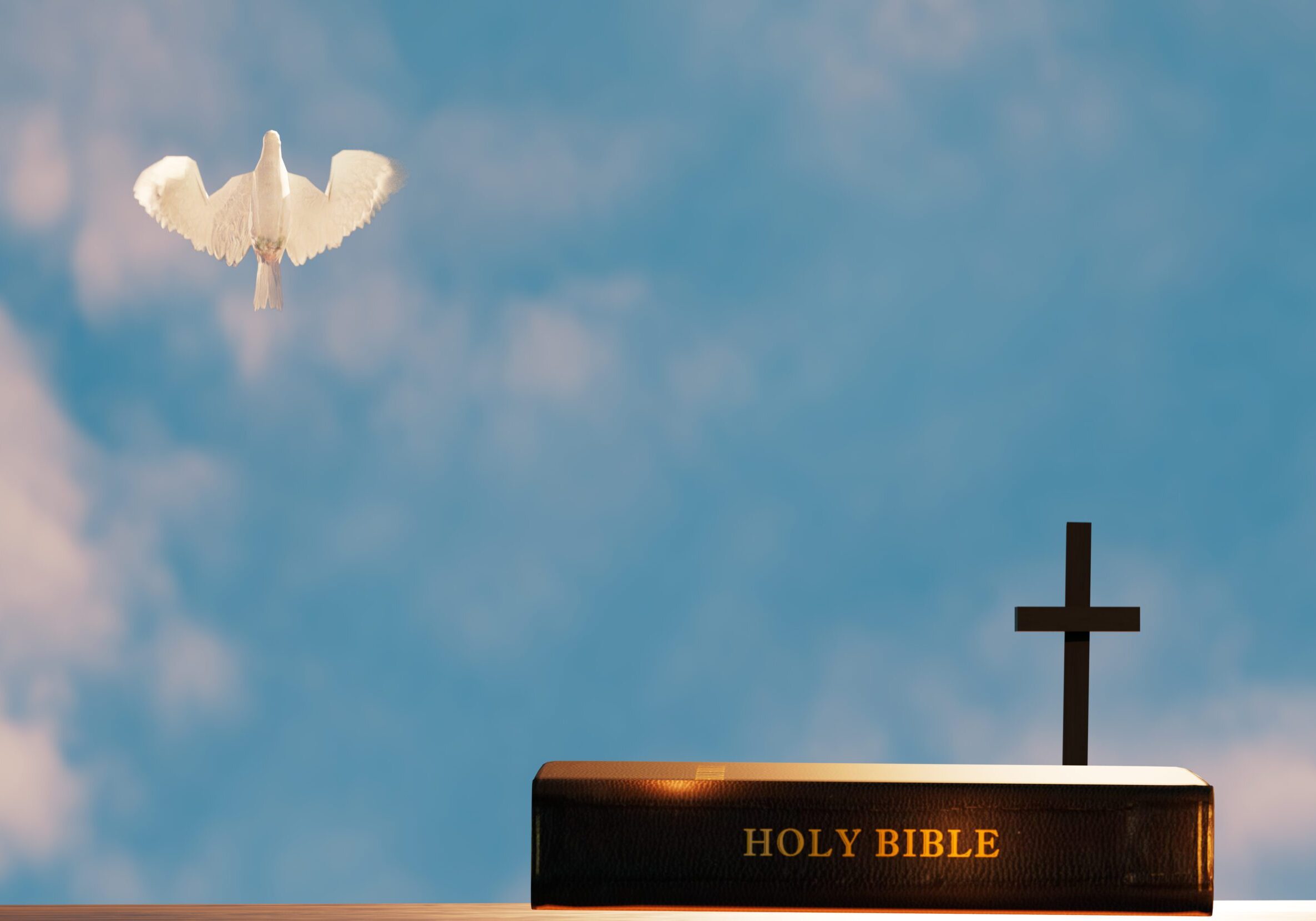Dove flying above Bible and cross.